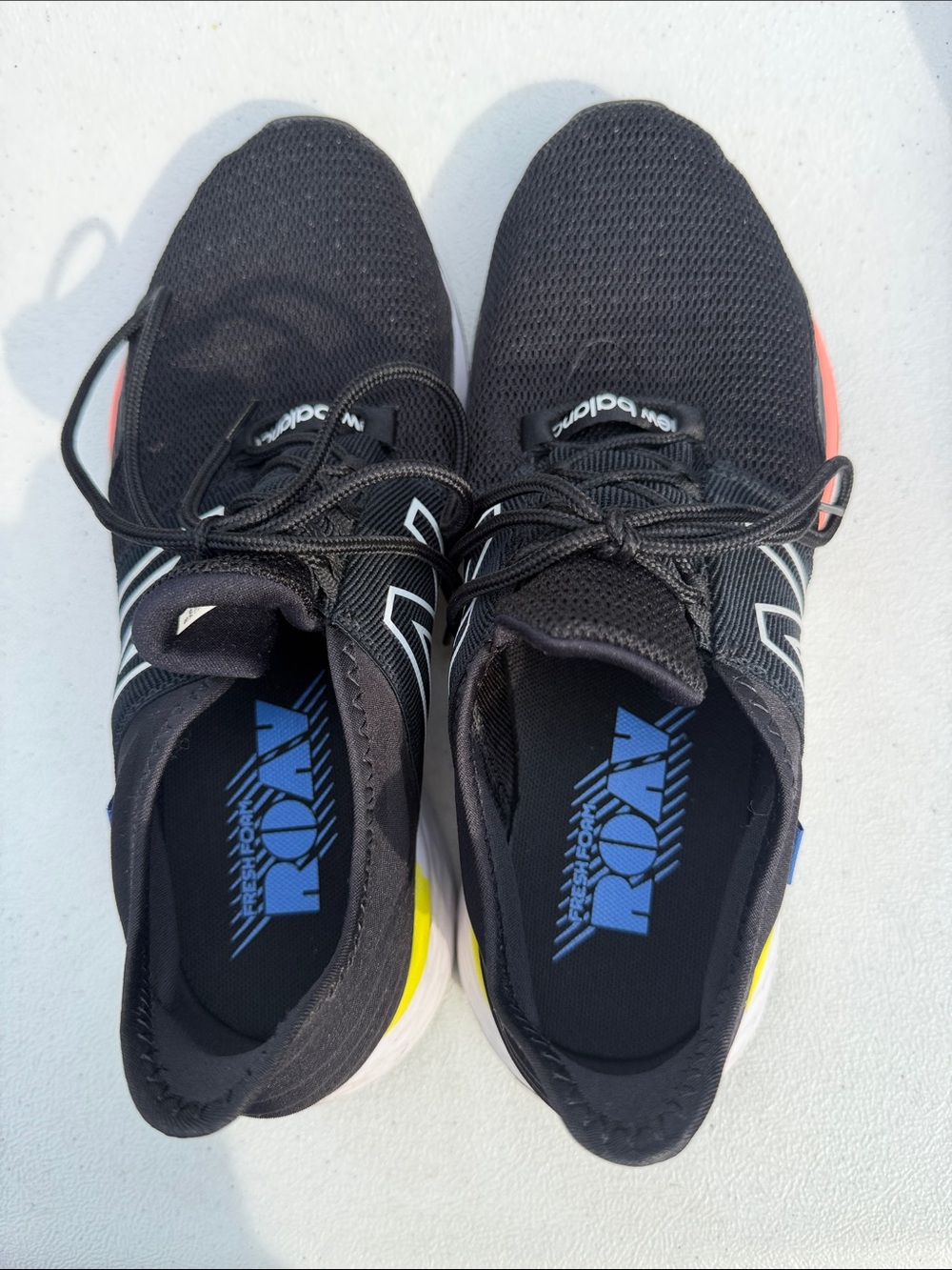 New Balance Black Athletic Shoes with Blue, pink and Yellow Accents